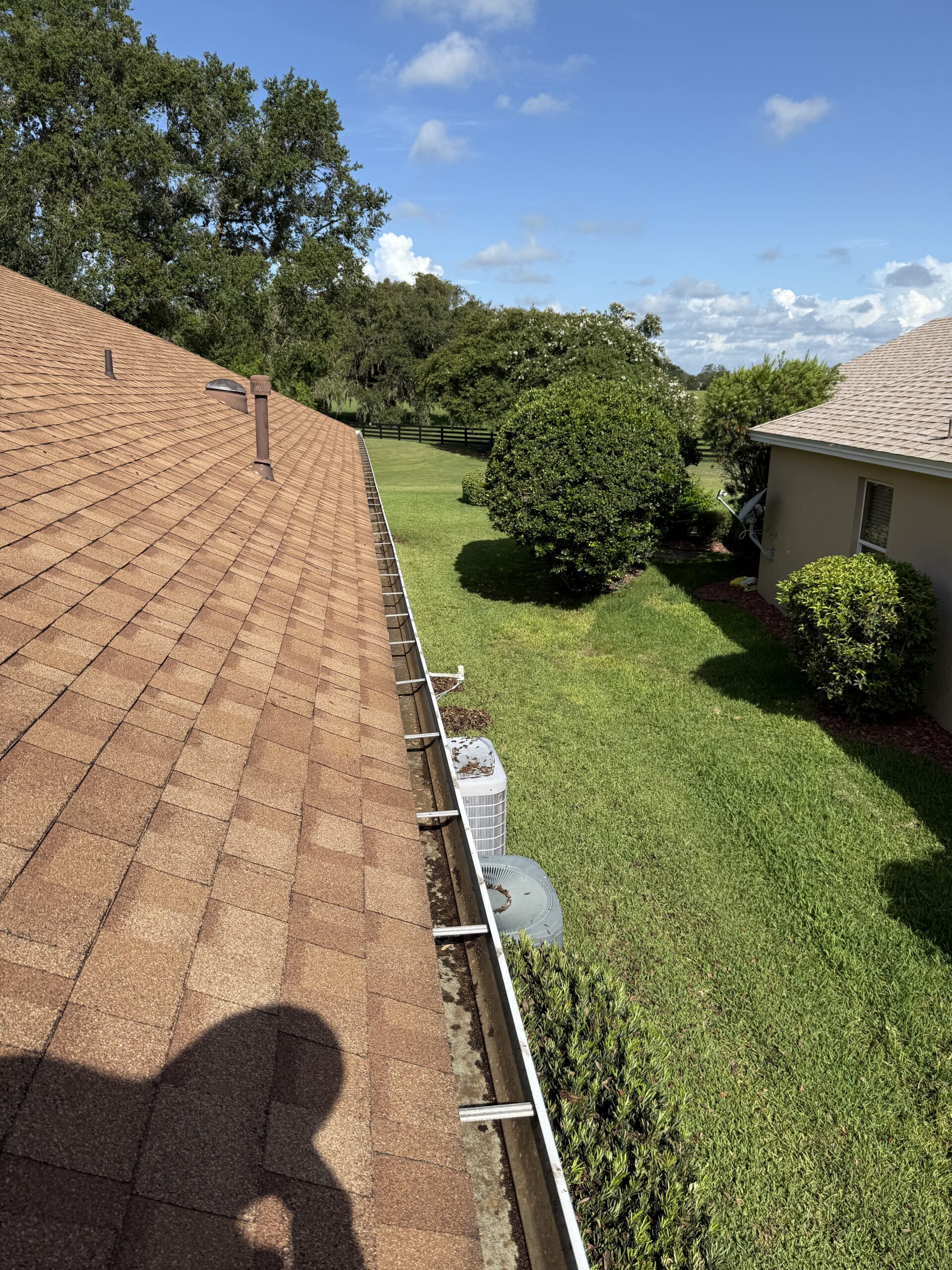 Clean residential roofline and gutter system at a home in The Villages, Florida
