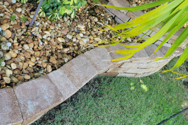 Pressure washed concrete edging and landscape stone border at a home in The Villages, Florida