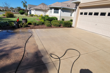 Driveway pressure washing service in The Villages, Florida removing surface stains and buildup